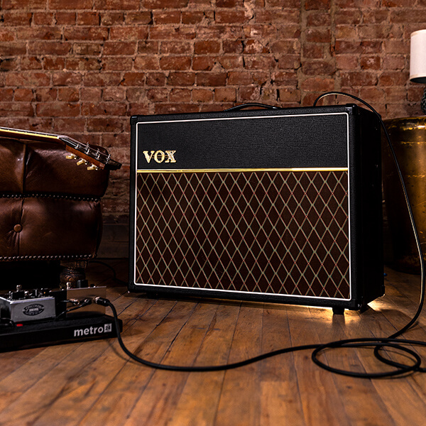 guitar laying on vox amp