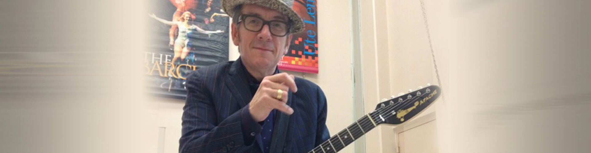artist, Elvis Costello, holding electric guitar
