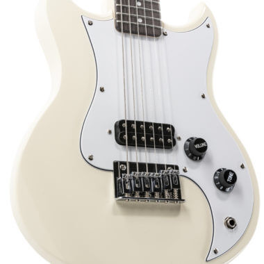 closeup of body of white VOX mini electric guitar 
