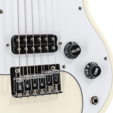 closeup of body of white VOX mini electric guitar