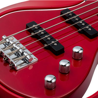 closeup of body of red VOX Starstream electric guitar
