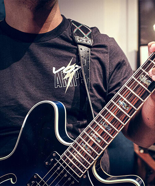 guitar player wearing Vox t-shirt