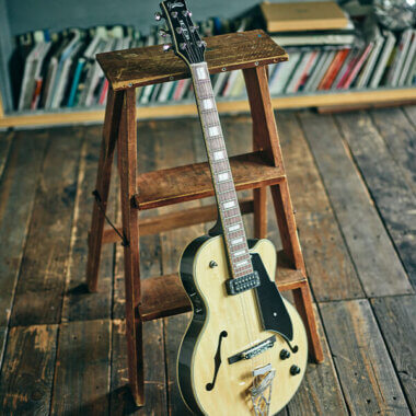 Vox Giulietta Vga-5td Archtop Electric Guitar Natural Gunmetallic leaning on small ladder.