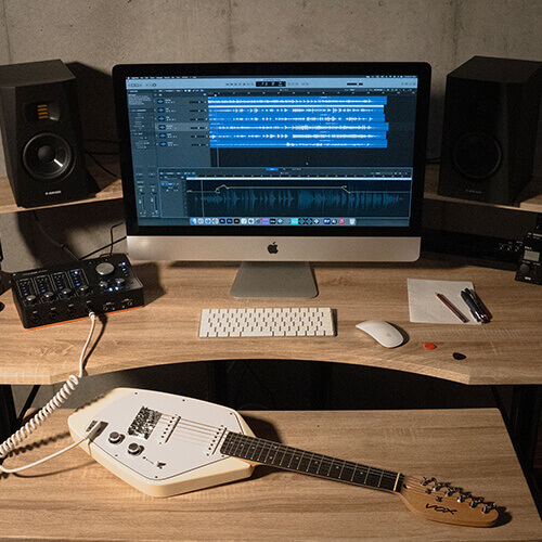 Vox Mark V Mini Guitar white on studio desk.