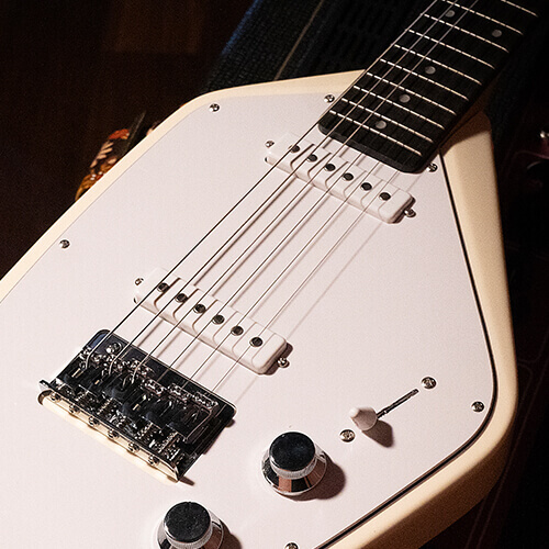 Vox Mark V Mini Guitar white body close up.