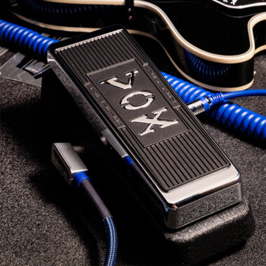 Vox Real McCoy Wah pedal on ground with guitar