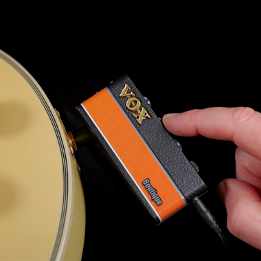 Vox amPlug3 Headphone Guitar Amplifier mounted on a gold guitar