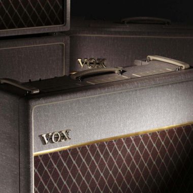 closeup of VOX amplifier with VOX amplifiers in the background