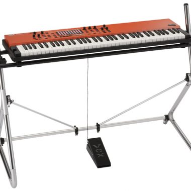 orange VOX keyboard on stand
