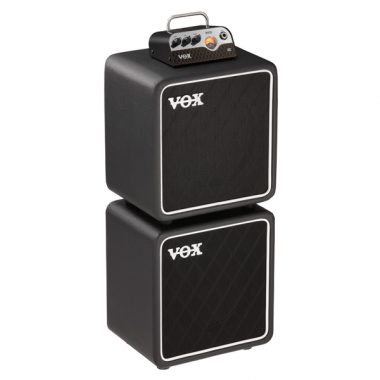 VOX tube head on top of two VOX guitar amplifiers