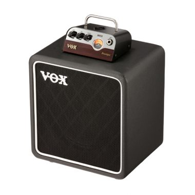 VOX amplifier head on top of VOX speaker