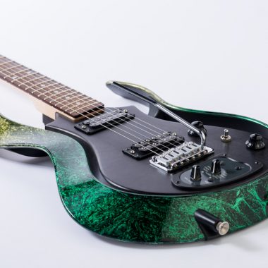 green and black VOX electric guitar
