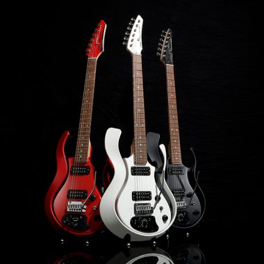 red, white, and black VOX electric guitar